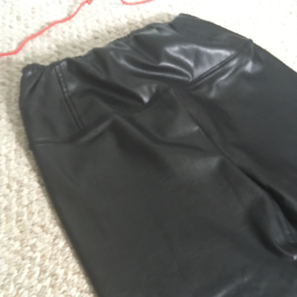 Black faux leather leggings.